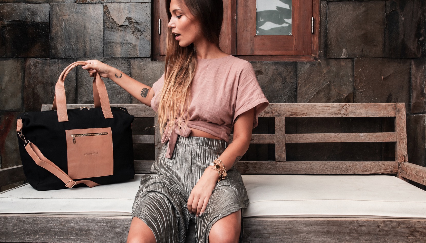 Lifestyle campaign featuring a black and tan Obi Kinomi tote